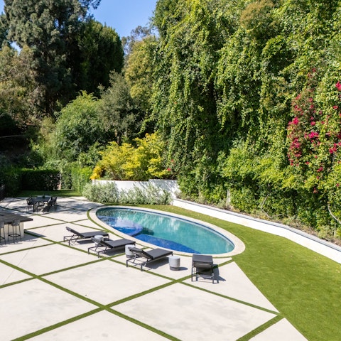 Sink into holiday mode in the pool, complete with an in-built hot tub