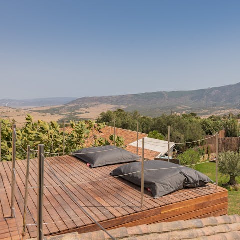 Relax on the rooftop while gazing out at the vista