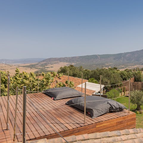 Relax on the rooftop while gazing out at the vista