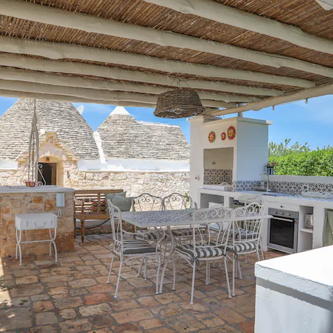 Cook up some pasta alla norma in the summer kitchen and dine alfresco