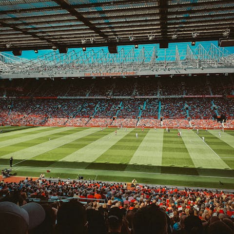 Catch a game at Old Trafford Stadium, a ten-minute drive away