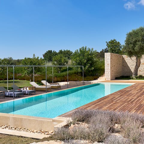 Spend luxurious afternoon by the pool – working on your tan and taking cool dips in its waters