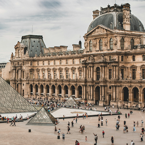 Admire the Mona Lisa in the Louvre Museum