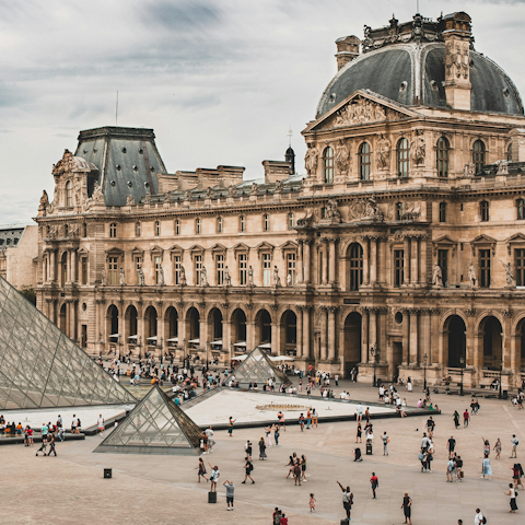Admire the Mona Lisa in the Louvre Museum
