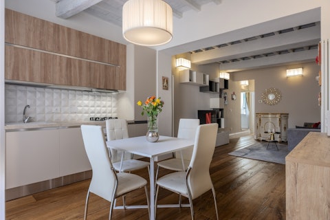 Gather with friends in the long living space for dinners