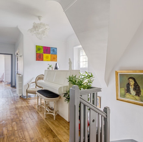 Treat guests to a sing-song around the white piano on the landing