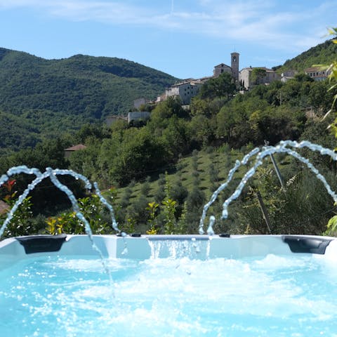 Sit back as the bubbles flow over your body in the hot tub