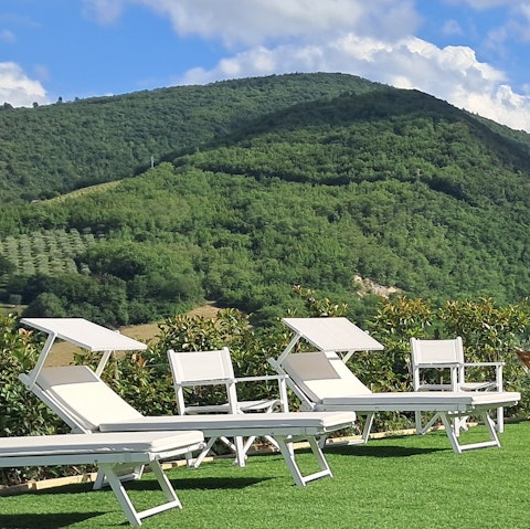 Breathe in the fresh air as you lay on a lounger