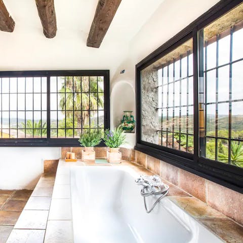 Enjoy the view of the Catalonian countryside from the huge bathroom