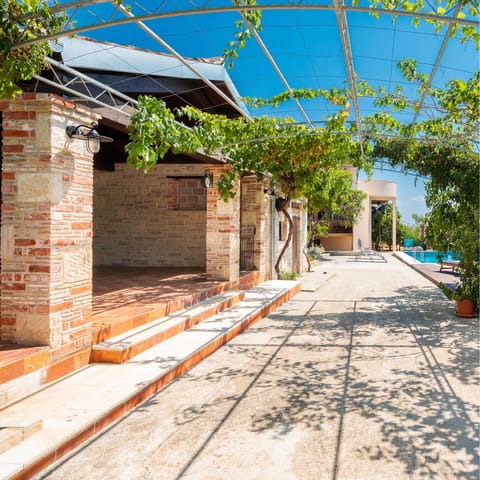Languish on an outdoor sofa and dining area secluded away in the private courtyard
