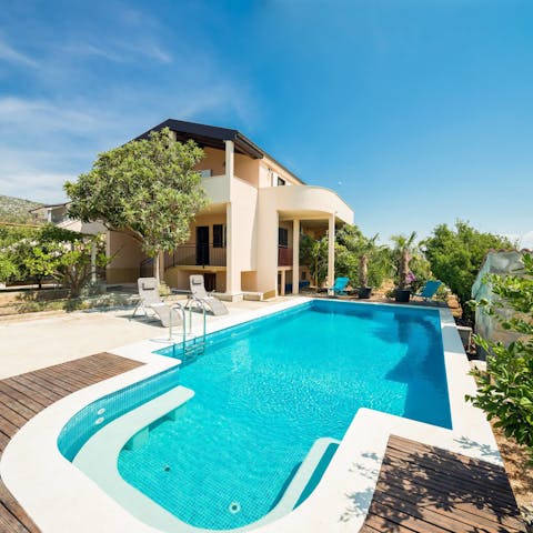 Enjoy a scenic swim in the private pool