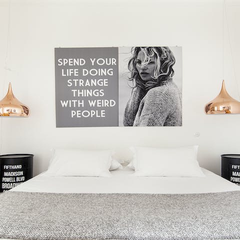 Get some rest in the stylish bedrooms with their modern artwork