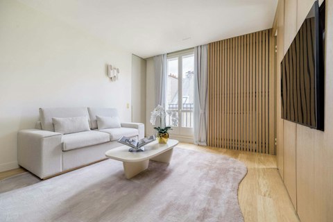 Settle into a light-filled Parisian living room with views