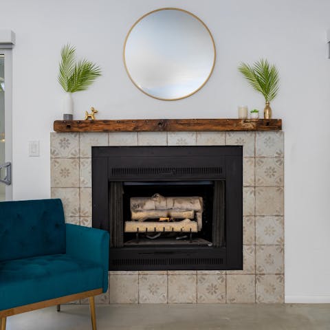 Gather by the fireplace for a cosy evening at the end of the day
