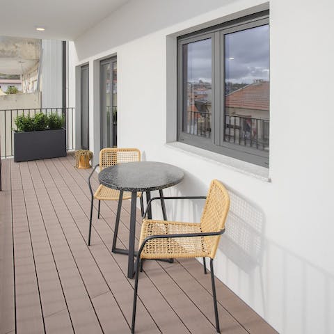 Grab a seat on the balcony and sip a chilled glass of ginjinha