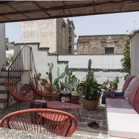 Enjoy an aperitivo on the rooftop as the sun sets