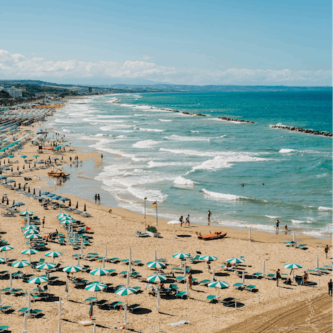 Unwind at the beach, within a five–minute walk away