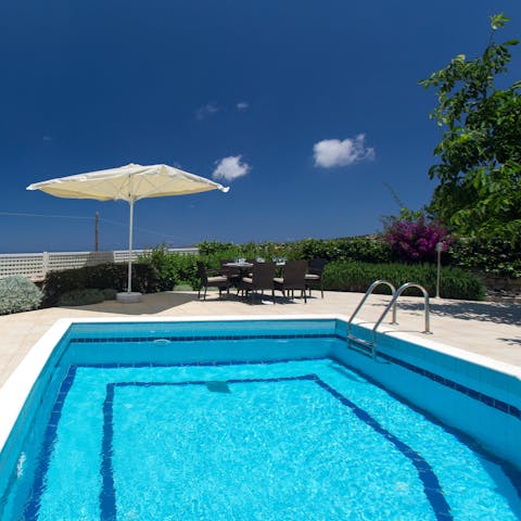 Watch your loved ones splash about in the pool as you relax on a lounger
