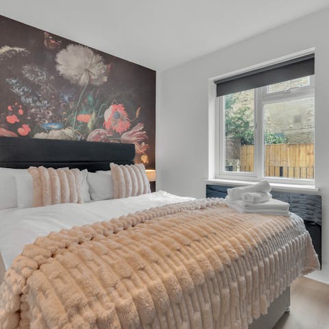 Draw the blackout blinds in the boutique-style bedroom
