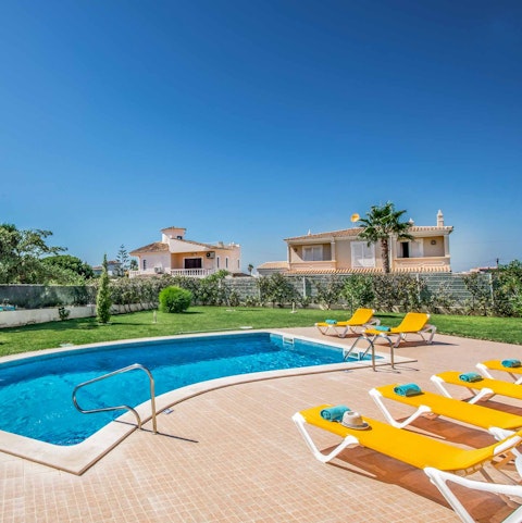 Top up your tan while lazing on loungers beside the pool