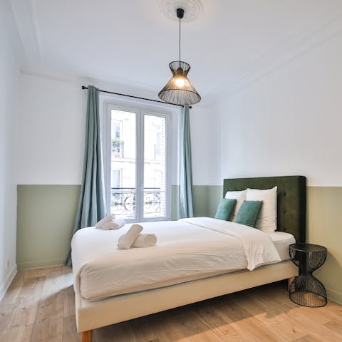 Wake to the world of Paris with city street views from the bedroom