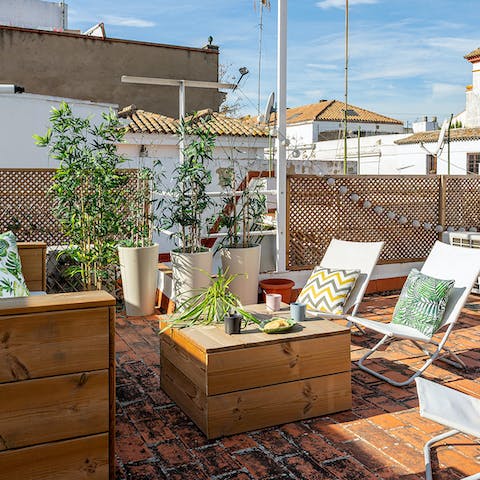 Sunbathe and enjoy some cool drinks on the fabulous rooftop terrace