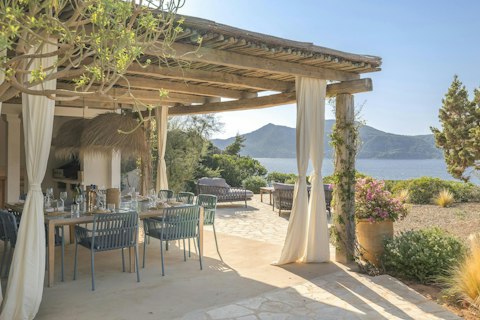 Dine under the pergola with sea and mountain views