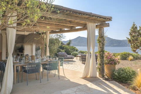 Dine under the pergola with sea and mountain views