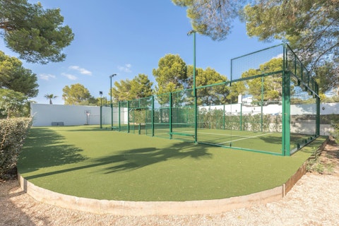 Serve out a match on the full-size padel court