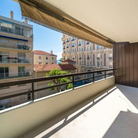 Enjoy a glass of Champagne on the private balcony