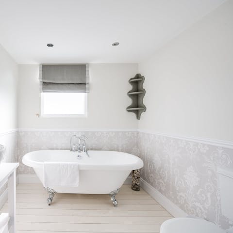 Soak in the roll-top bathtub after a busy day exploring the coast