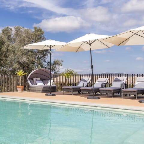 Relax on a lounger by the pool
