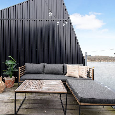 Soak up the waterside vistas with coffees on the private terrace