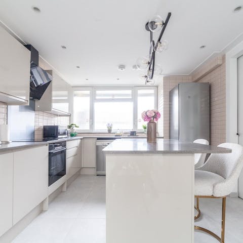 Prepare your own home-cooked meals in the sleek, fully equipped kitchen, with a dishwasher to make clean-up easy
