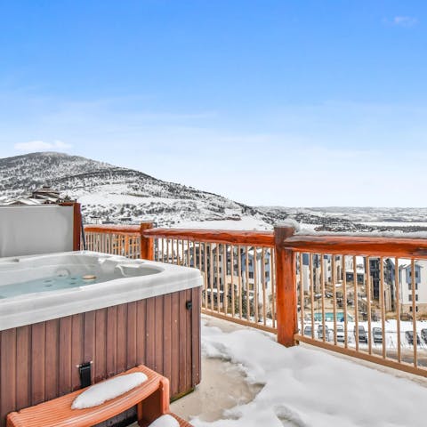 Soak in the private hot tub with a view, after a day on the slopes