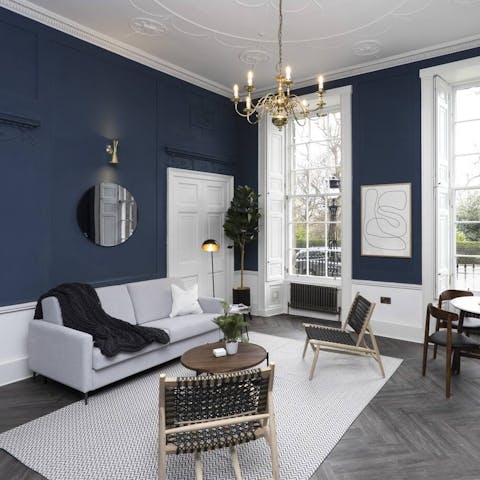 Sit down to elegant drinks in the ballroom-vibe living room