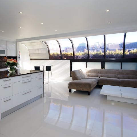 A smartly finished kitchen with lounge area