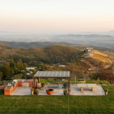 Barbecue and gather on the terrace as rolling hills extend to the horizon