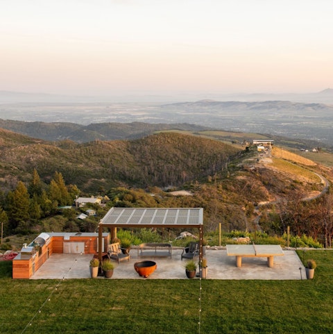 Barbecue and gather on the terrace as rolling hills extend to the horizon