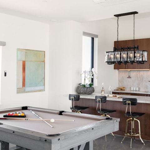 Shoot some pool then pull up a stool at the marble bar