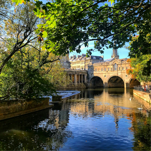 Wander along the scenic River Avon and Pulteney Bridge