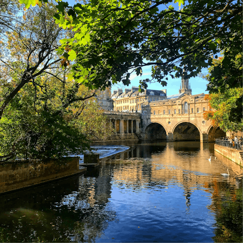 Wander along the scenic River Avon and Pulteney Bridge