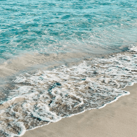 Let the sea wash over your feet at Cala Llonga beach, just 7km away