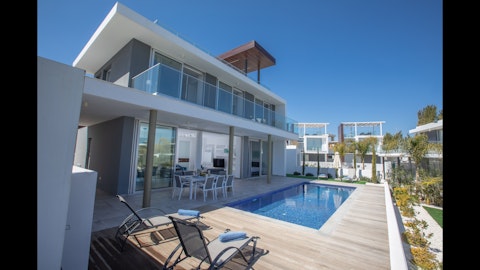 Stretch out on the sun lounger beside your private pool