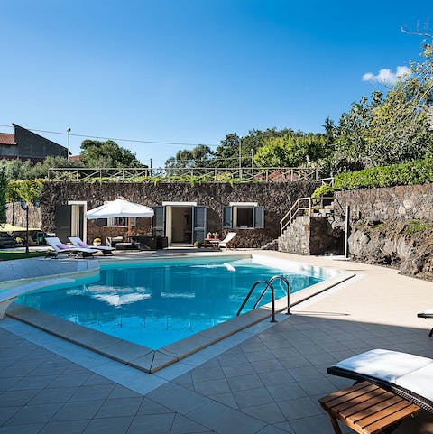 Spend your afternoons relaxing by the pool under the sun