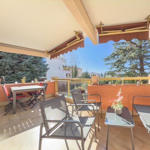 Relax and dine on the pretty covered terrace