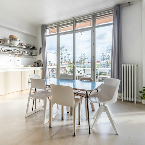 Sit down for a meal in the bright dining area while feasting on views from the floor-to-ceiling windows