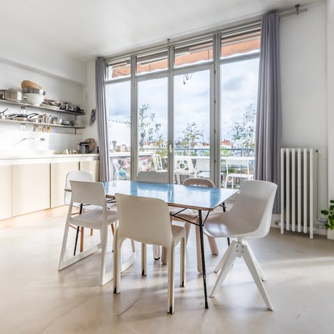 Sit down for a meal in the bright dining area while feasting on views from the floor-to-ceiling windows