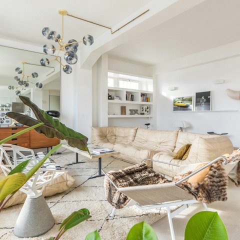 Relax with a glass of wine amidst the greenery in your stylish living room