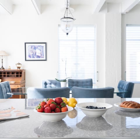 The wide marble kitchen island